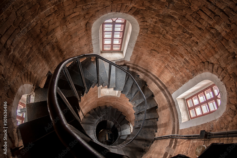Fototapeta premium Stone steps. Old staircase leading up towards the light.