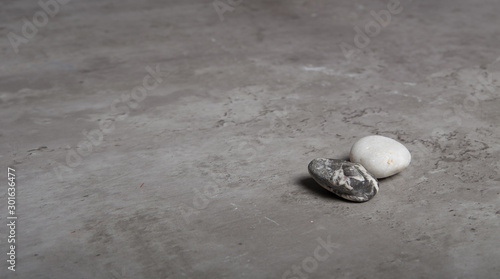 two stones on a grey table