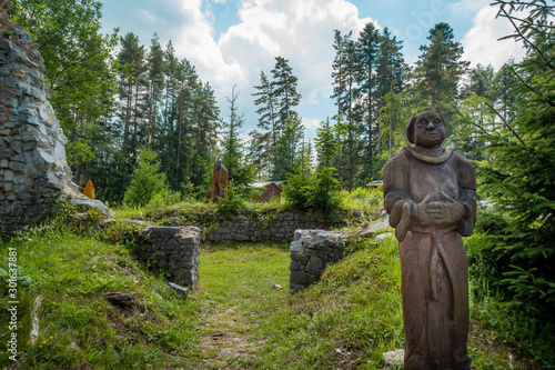 Obraz na płótnie Slovak Paradise, Letanovce / Slovakia - Wooden statue of a monk in the ruins of