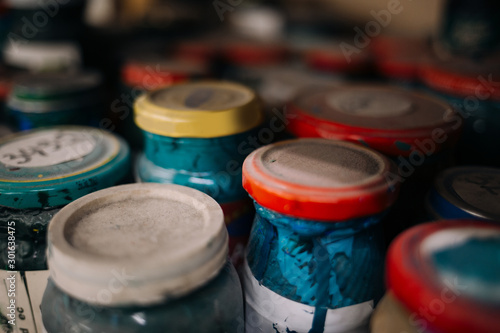 Old paint cans with dust