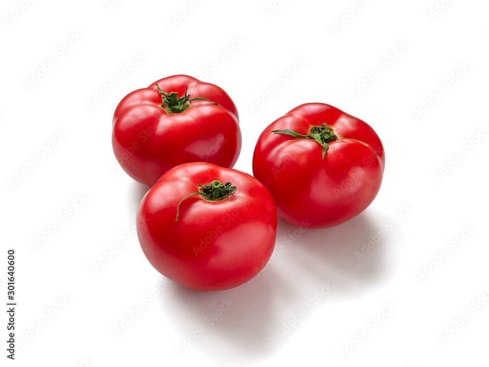 Three red, ripe tomatoes on a white background Three red, ripe tomatoes on a white background