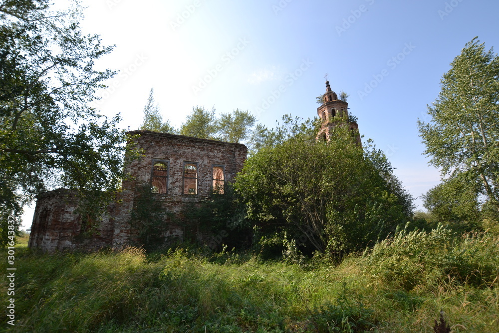 Sunny day on Kama: the ruins of the Church of Our Lady of God (Vladimirskaya - Rubezhskaya) in Usolye