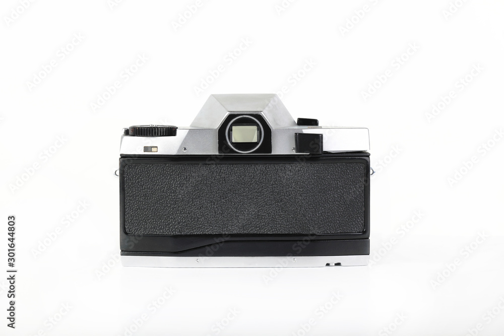 The old 35 mm film camera with lens, on white background. The old 35 mm film camera with lens, on white background.
