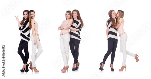 Two female friends isolated on the white