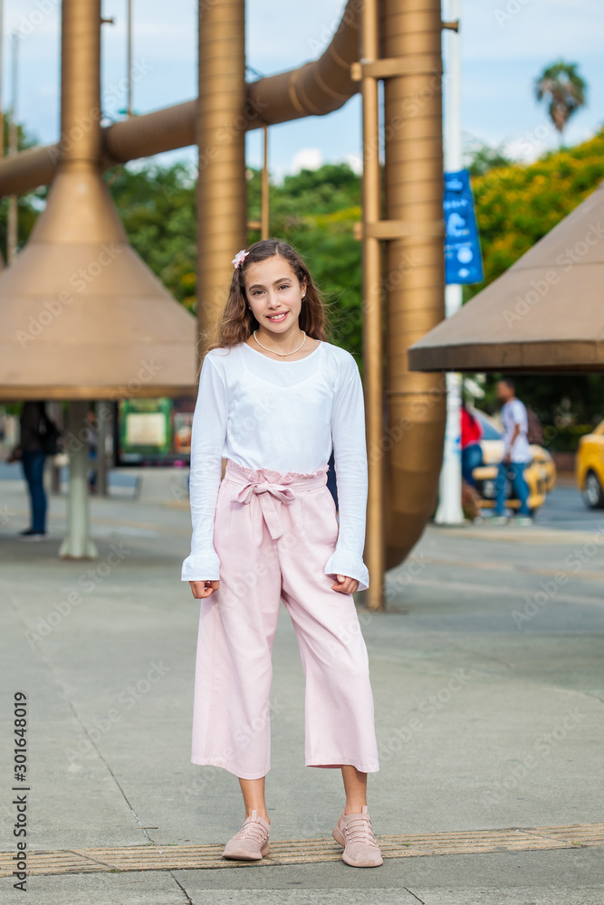 Beautiful young girl at the Jairo Varela Square in the city of Cali in Colombia