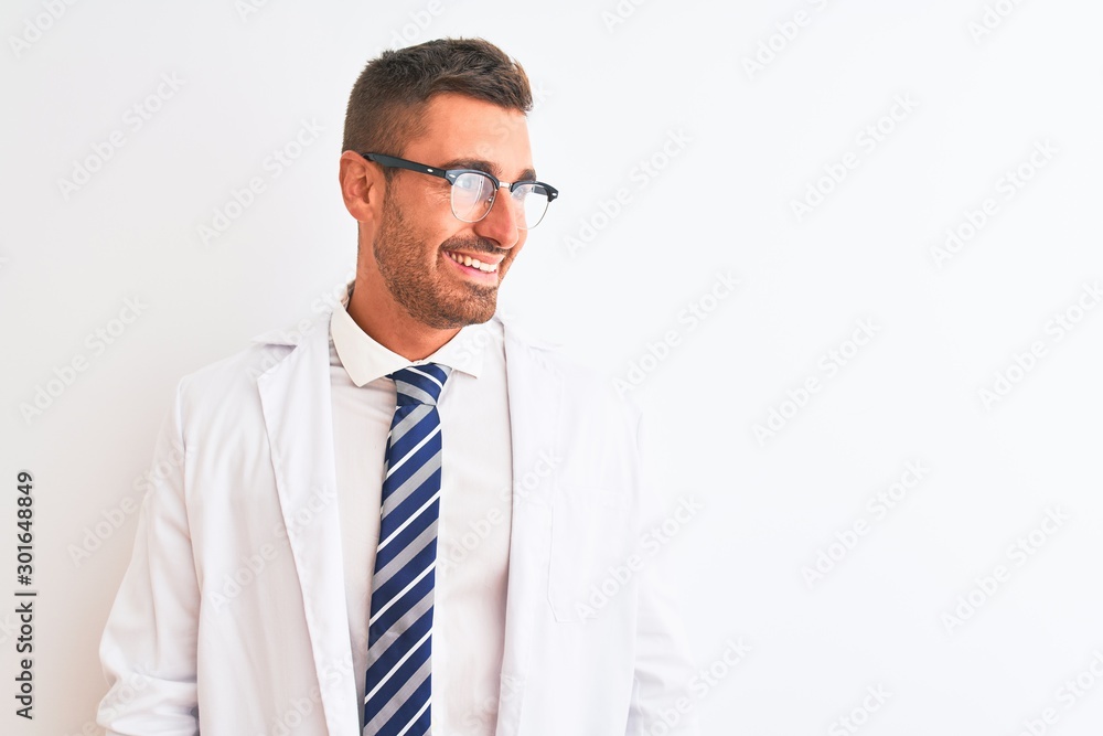 Young handsome therapist man over isolated background looking away to side with smile on face, natural expression. Laughing confident. Young handsome therapist man over isolated background looking away to side with smile on face, natural expression. Laughing confident.