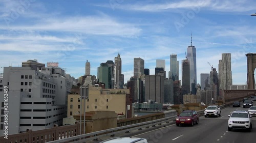 New York, United States - October 16, 2019: Cars speeding on the Brooklyn Bridge, Manhattan. One of the most emblematic bridges in the world, a must-see attraction when visiting New York.