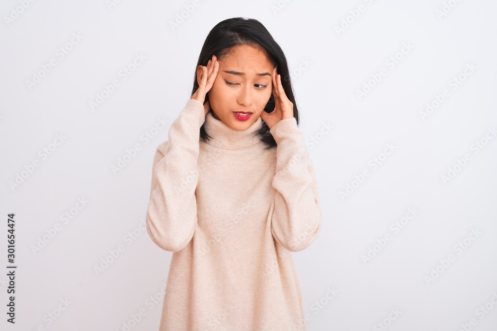 Young chinese woman wearing turtleneck sweater standing over isolated white background with hand on headache because stress. Suffering migraine. Young chinese woman wearing turtleneck sweater standing over isolated white background with hand on headache because stress. Suffering migraine.