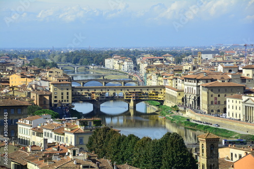 The Ponte Vecchio bridge and the Arno river in Florence Italy