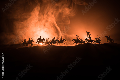 Dekoracja na wymiar  medieval-battle-scene-with-cavalry-and-infantry-silhouettes-of-figures-as-separate-objects-fight-between-warriors-on-dark-toned-foggy-background-night-scene
