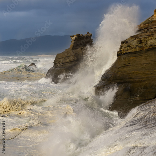 Waves crashing against rocks at Cape Kiwanda State Natural Area near Pacific City, Oregon.