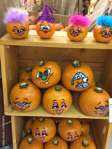 Little funny pumpkins in wooden box