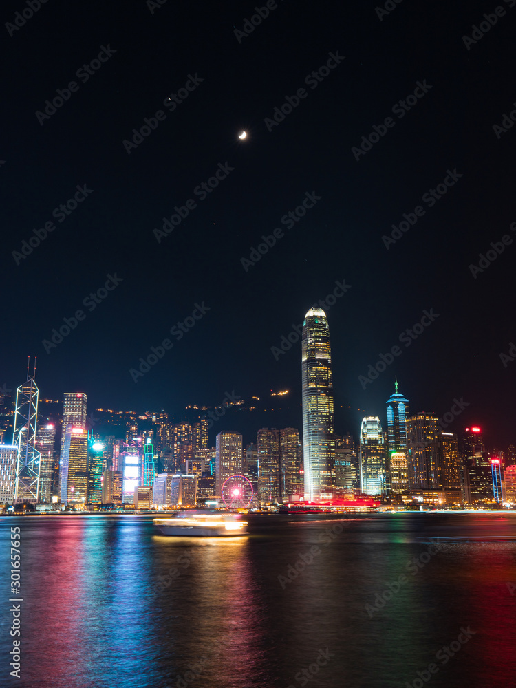 custom made wallpaper toronto digitalSkyline of Hong Kong Island at night with boat trails on Victoria Harbour.