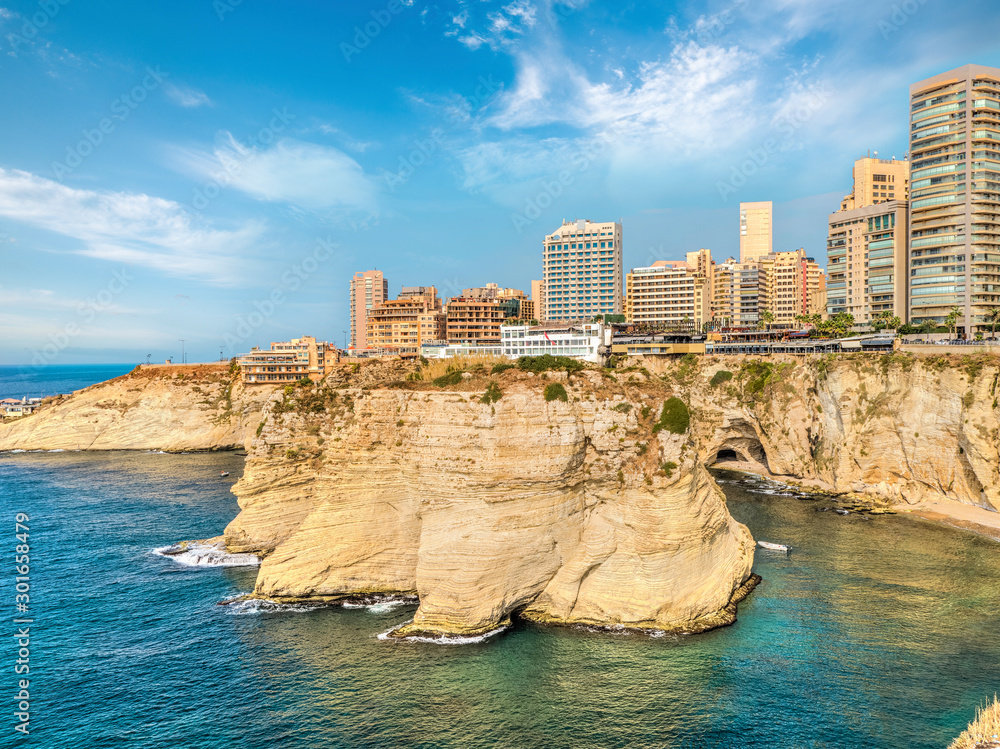 Naklejka premium Rouche rocks in Beirut, Lebanon in the sea during daytime. Pigeon Rocks in Mediterranean sea.