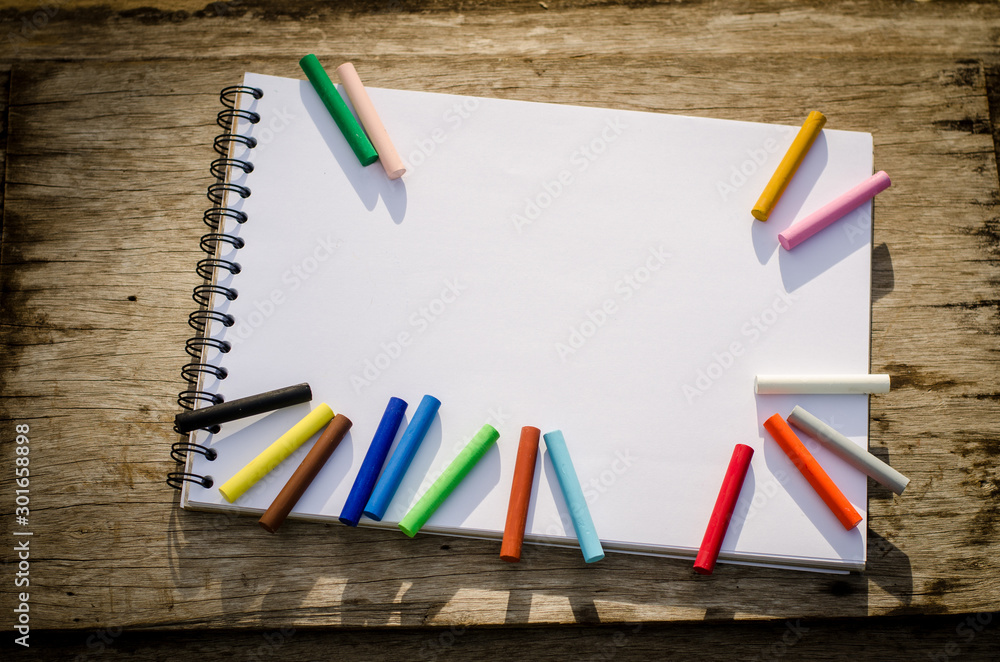 School notebooks and stationery on wooden planks. Back to school concepts. School notebooks and stationery on wooden planks. Back to school concepts.