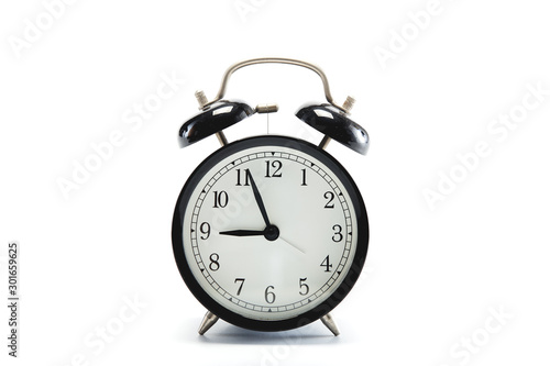 black vintage alarm clock on white background