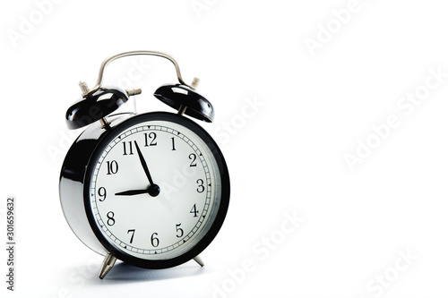 black vintage alarm clock on white background