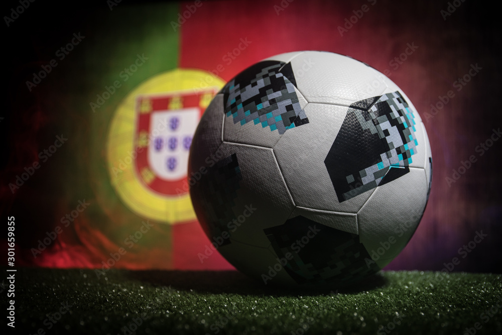 BAKU,AZERBAIJAN - JUNE 21, 2018 : Creative concept. Official Russia 2018  World Cup football ball The Adidas Telstar 18 on dark toned foggy  background with flag of Portugal. Stock Photo | Adobe Stock