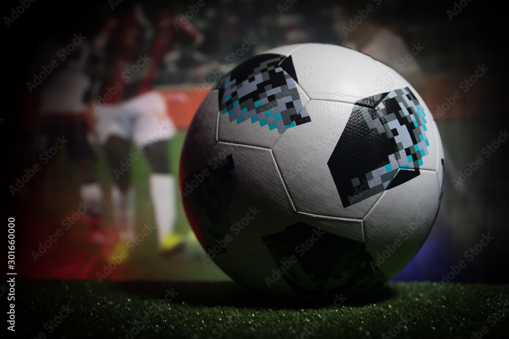 BAKU,AZERBAIJAN - JUNE 21, 2018 : Creative concept. Official Russia 2018  World Cup football ball The Adidas Telstar 18 on dark toned foggy  background with playing game at the stadium. Stock Photo | Adobe Stock