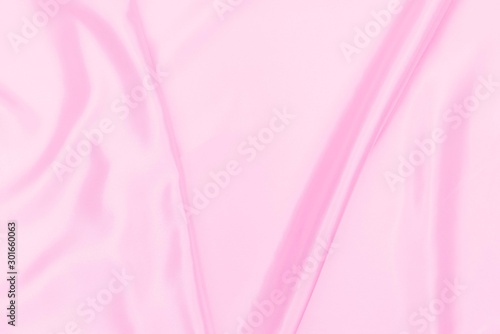 Plastic pink satin fabric texture soft blur background