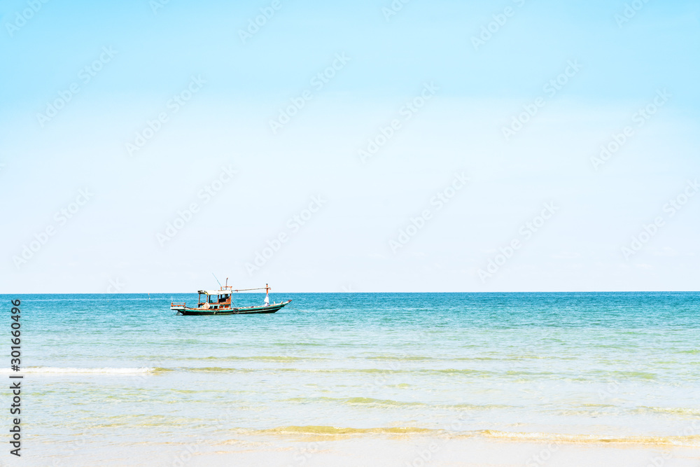 Coastal fishing boats with sea view and blue sky in summer