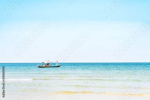 Coastal fishing boats with sea view and blue sky in summer
