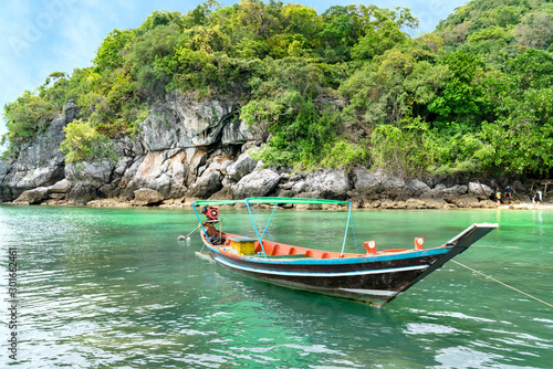 long tail boat and island in Thailand sea