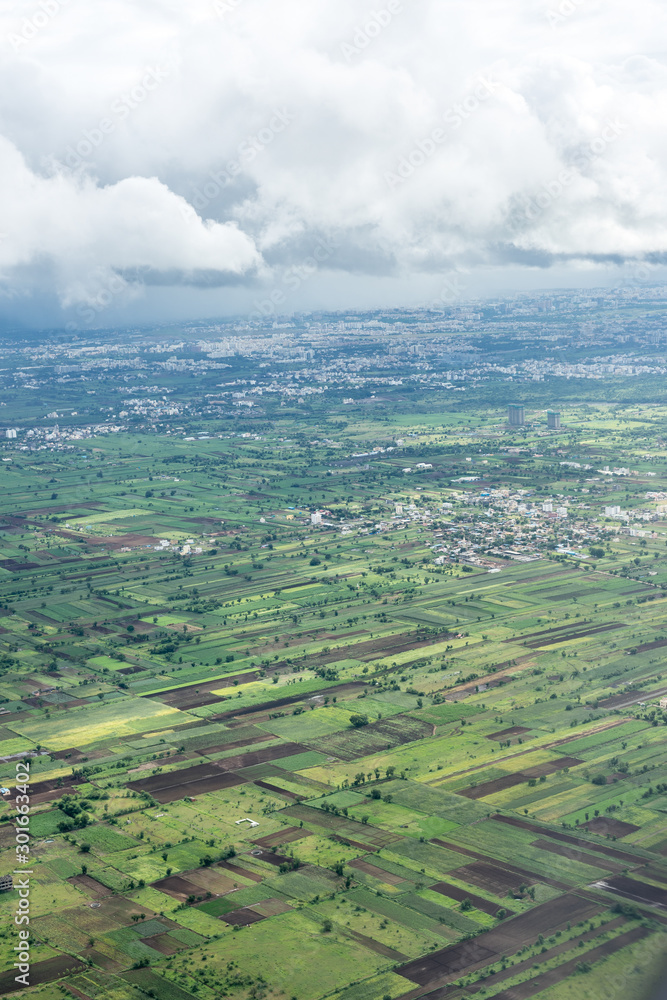 Bangalore to Pune, , a large green field with a mountain in the background