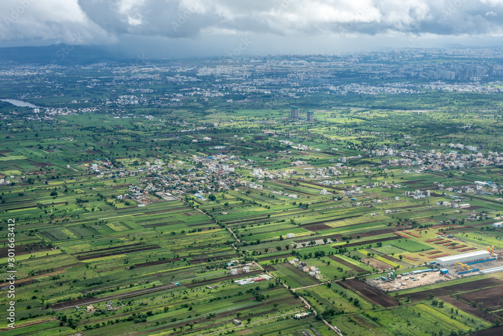 Bangalore to Pune, , a large green field with a mountain in the background