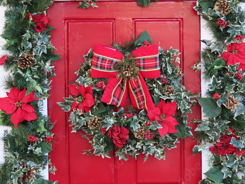 Ornate door for christmas. Bows, garland and more Christmas items
