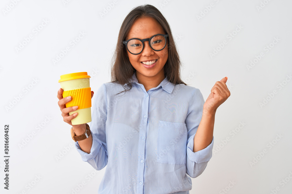 Young chinese woman wearing glasses holding glass of coffee over isolated white background screaming proud and celebrating victory and success very excited, cheering emotion Young chinese woman wearing glasses holding glass of coffee over isolated white background screaming proud and celebrating victory and success very excited, cheering emotion