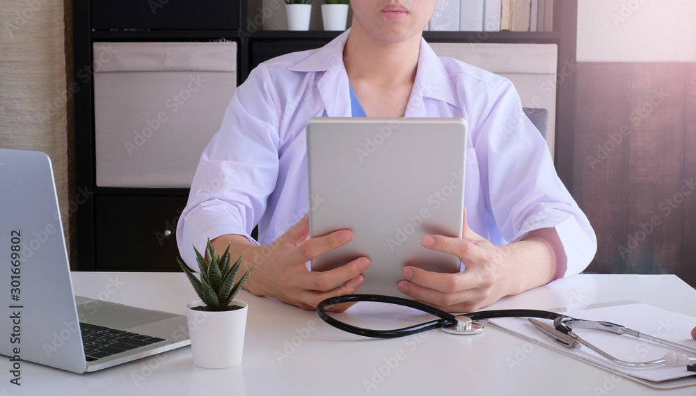 doctor work for online medical service. using tablet to consult with patient doctor work for online medical service. using tablet to consult with patient