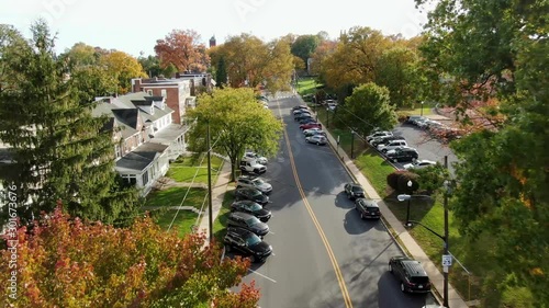 Aerial of fraternity sororities homes, Greek life beside college campus during autumn, colorful leaves photo