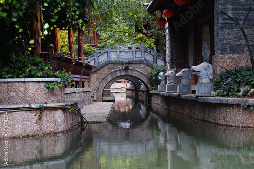Traditional oriental building along the canal. Shuhe ancient town is a small village a couple miles to the north of Lijiang, in Yunnan province. 