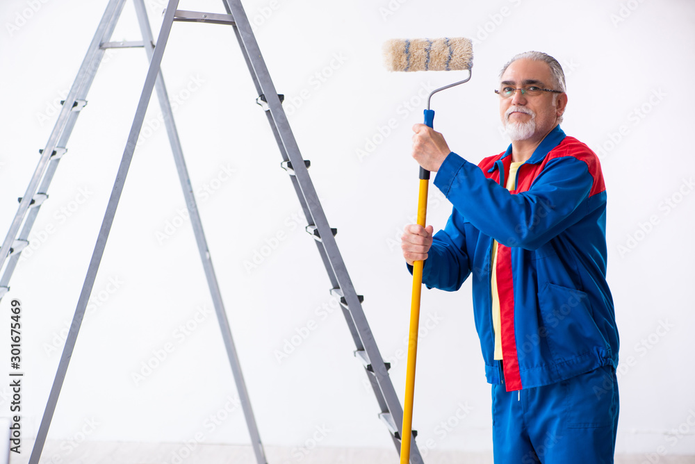 Old contractor doing renovation at home Old contractor doing renovation at home
