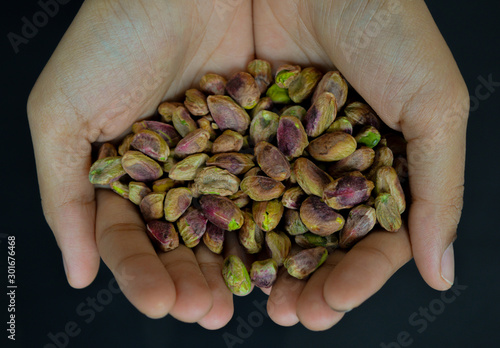 hands full of pistachios