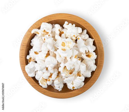 Popcorn in wooden cup bowl on white background top view