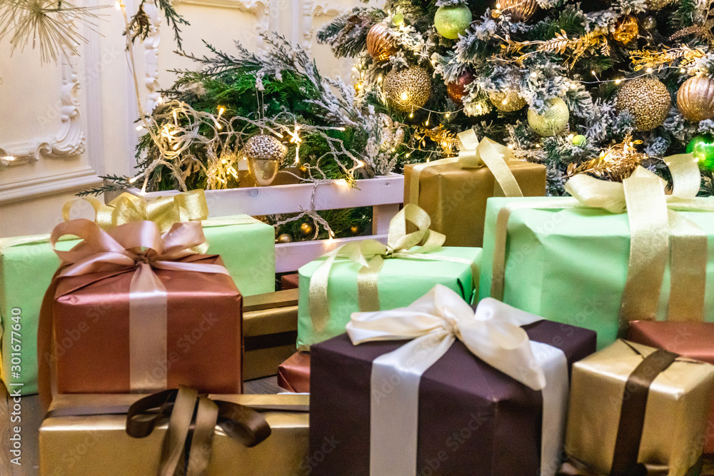 Decorated boxes with New Year gifts tied with ribbons Decorated boxes with New Year gifts tied with ribbons