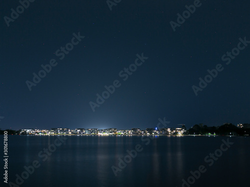 View of Kingston Foreshore at night looking over Lake Burley Griffin in Canberra, the capital city of Australia photo