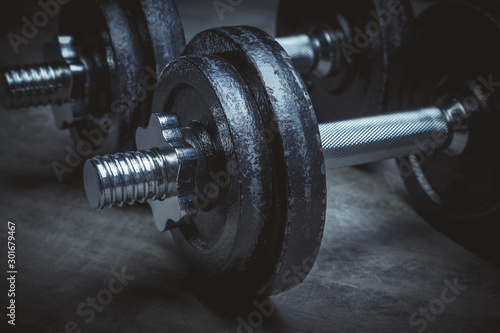 Steel dumbbells for training in the gym