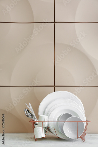 Clean white dishes and silv...