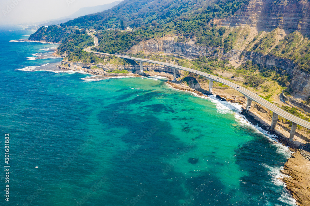 Aerial view of the iconic Sea Cliff Bridge along the beautiful coast in the northern Illawarra region of New South Wales, Australia    