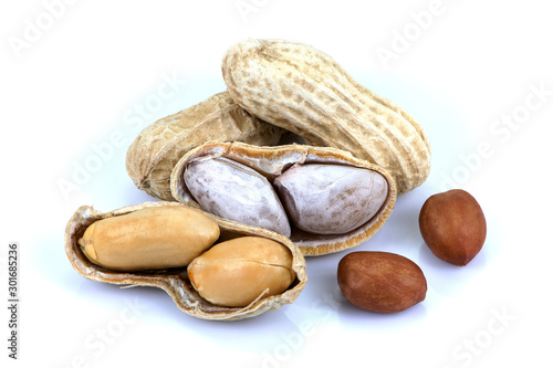 Peeled and unpeeled peanut or goober isolated on white background. Healthy food concept. 