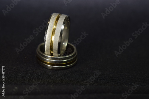 Two rings of gold and white gold are elegant and expensive and are a fine work for teenagers.