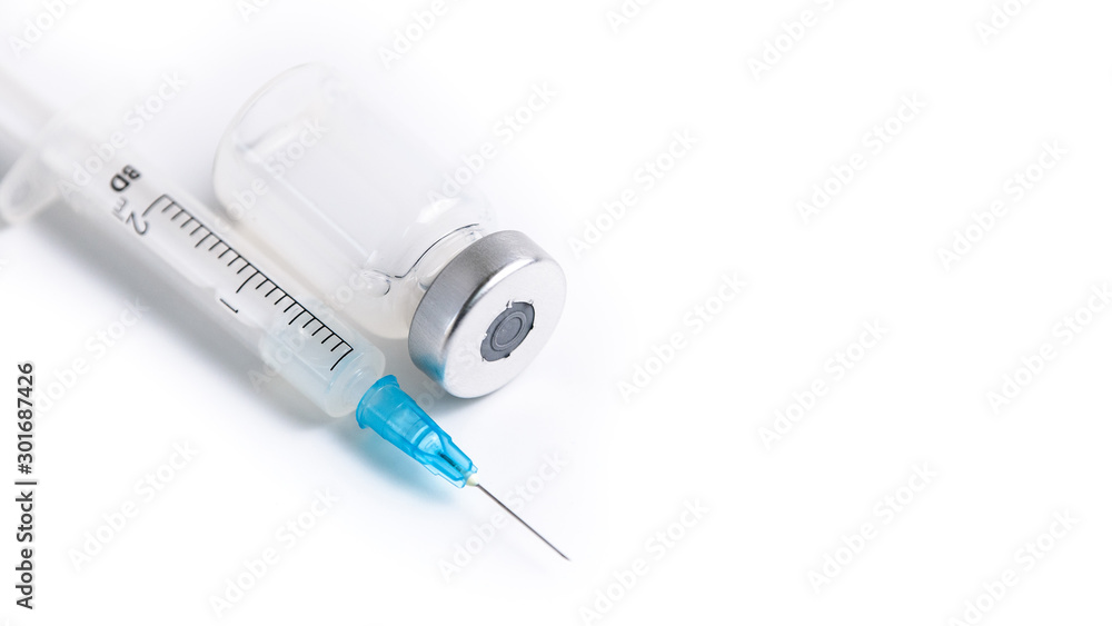Close up of measles and flu vaccine vials for child vaccination, medicine and drug concept Close up of measles and flu vaccine vials for child vaccination, medicine and drug concept