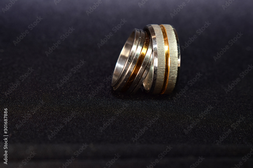 Two rings of gold and white gold are elegant and expensive and are a fine work for teenagers. Two rings of gold and white gold are elegant and expensive and are a fine work for teenagers.