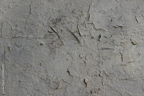 Texture of old plasterwork covered with peeled paint