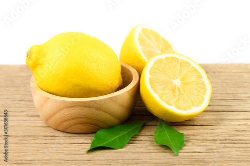 Fresh slice lemon with leaves, vitamin c supplement from natural  isolated on white background with copy space