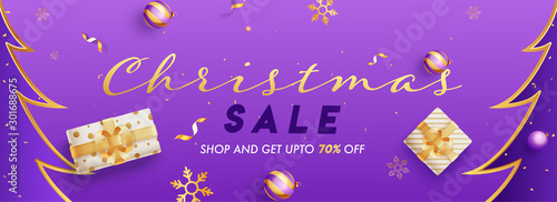 Christmas Sale header or banner design with 70% discount offer, gift boxes and baubles decorated on purple background.