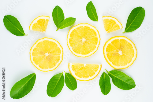 Fresh slice lemon with leaves, vitamin c supplement from natural isolated on white background with copy space
